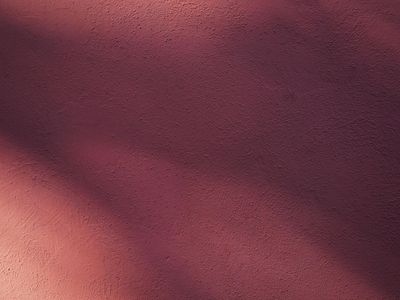 Soft light hitting a smooth textured wall surface.